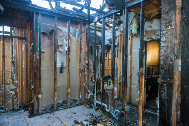 Professional Fire Damage Restoration technician working in Peach Lake, NY